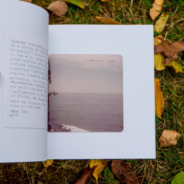 Interior page of it-self. in front of leaves and grass